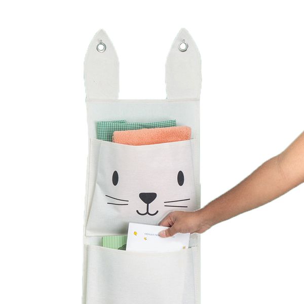 Cesto infantil de parede com 3 bolsos de algodão coelho - oikos